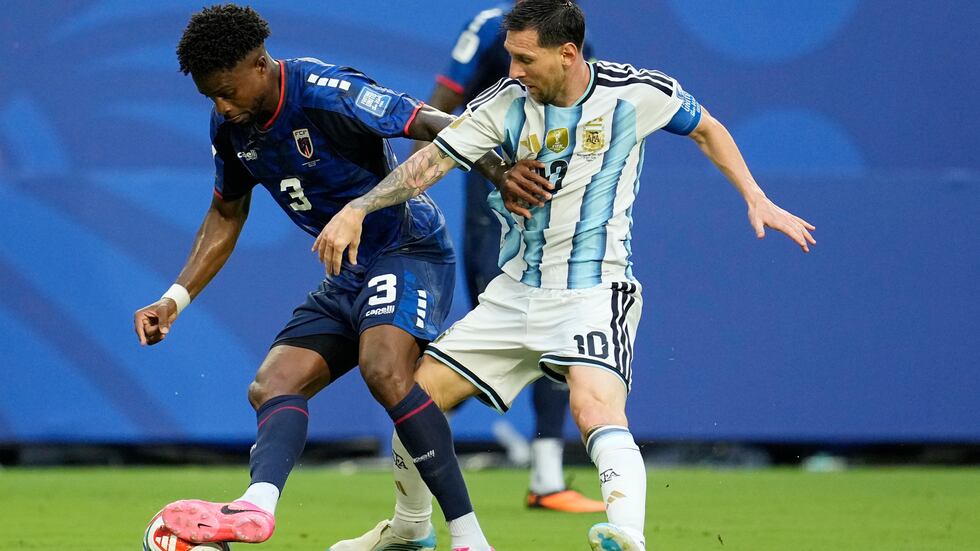 Cape Verde's Diney Borges (3) battles with Argentina's Lionel Messi (10) during the World Cup...
