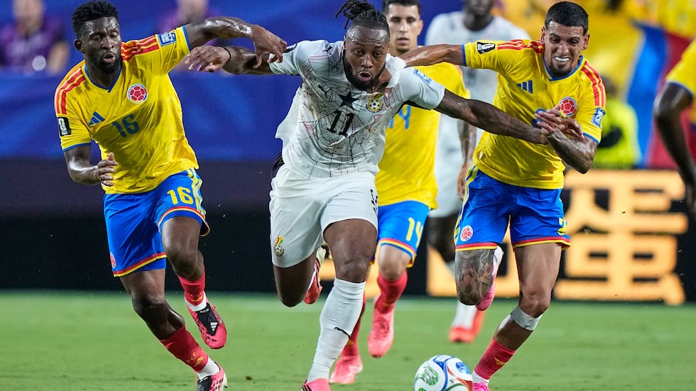 Ghana's Antoine Semenyo (11) battles for the ball Colombia's Jefferson Lerma (16) and Daniel...