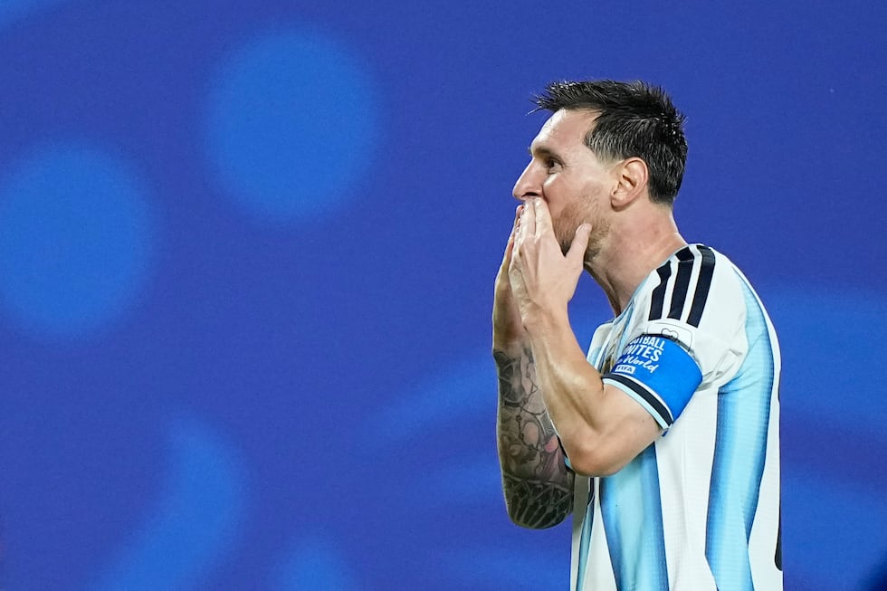 Argentina's Lionel Messi reacts after scoring his third goal during the World Cup Group J...