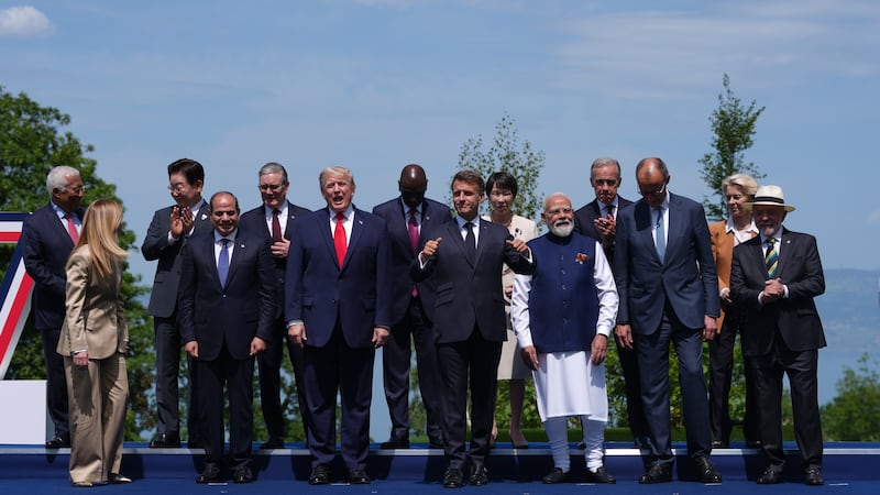 French President Emmanuel Macron, center, poses with leaders during a group photo of G7...